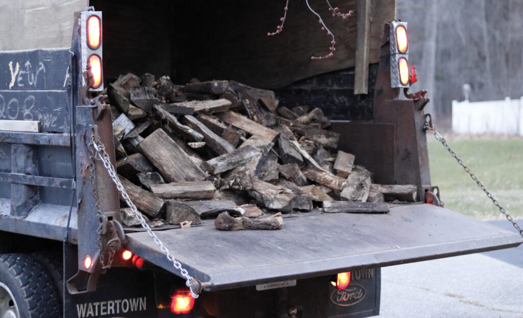 Firewood in dump truck